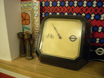 Photo of bycycle barometer on a mantelpiece